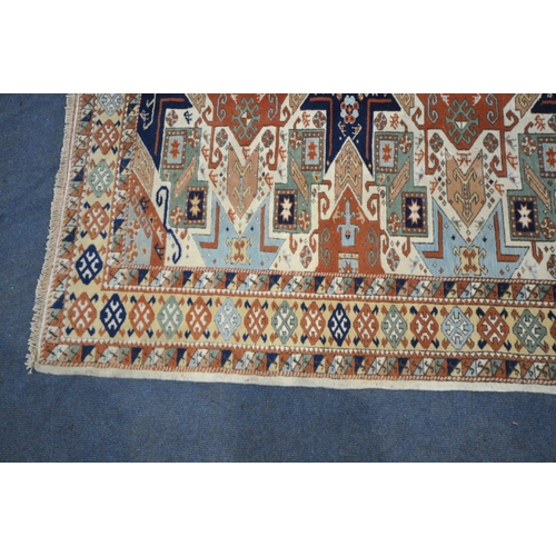 1288 - A PERSIAN WOOLEN RUG, with multi-coloured repeating geometric patterns and a multi-strap border, 217... 