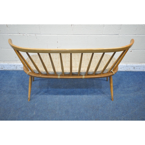 1291 - LUCIAN ERCOLANI, ERCOL, A MID CENTURY ELM AND BEECH DINING LOVE SEAT, with bentwood and spindle back... 