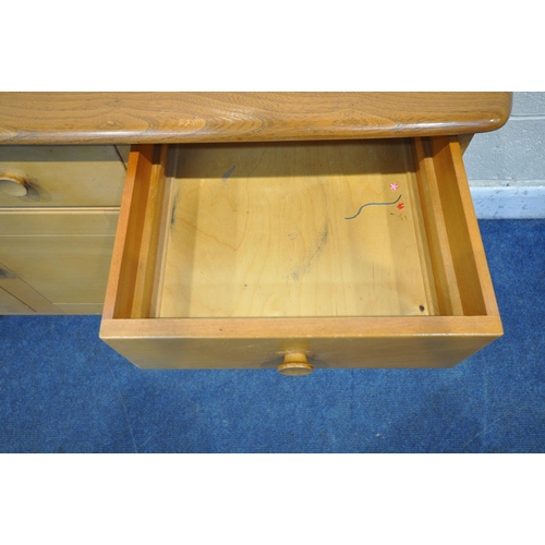 1292 - LUCIAN ERCOLANI, ERCOL, A MID CENTURY ELM AND BEECH SIDEBOARD, fitted with two drawers, above three ... 