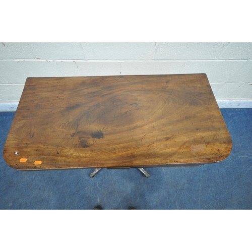 1304 - A REGENCY MAHOGANY FOLD OVER TEA TABLE, the revolving fold over top, enclosing a small storage compa... 