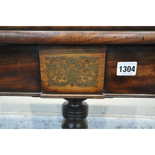 1304 - A REGENCY MAHOGANY FOLD OVER TEA TABLE, the revolving fold over top, enclosing a small storage compa... 