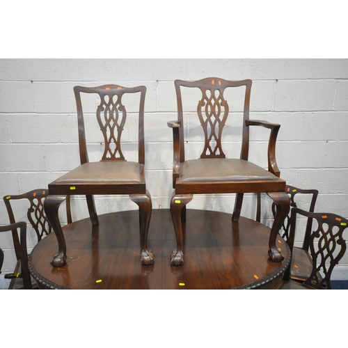 1307 - AN EARLY 2OTH CENTURY MAHOGANY OVAL WIND OUT DINING TABLE, the legs with scrolled and foliate detail... 