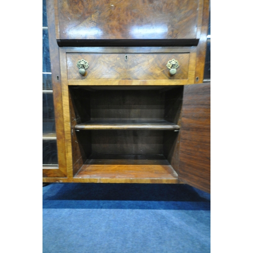 1314 - AN ART DECO WALNUT COCKTAIL CABINET, fitted with two glazed doors with geometric etching, flanking a... 