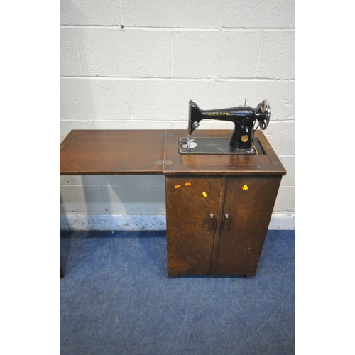 1323 - AN EARLY 20TH CENTURY OAK CASED SINGER TREADLE SEWING MACHINE, a gypsy wall mirror, an oval bevelled... 