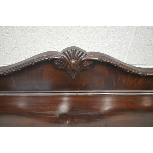 1324 - A 20TH CENTURY MAHOGANY SERPENTINE SIDEBOARD, with a raised back, fitted with double cupboard doors,... 