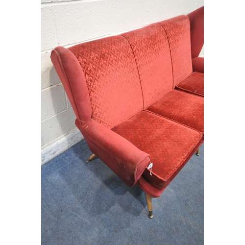 1329 - A 20TH CENTURY RED UPHOLSTERED WING BACK SOFA, on cylindrical tapered legs, length 175cm x depth 90c... 