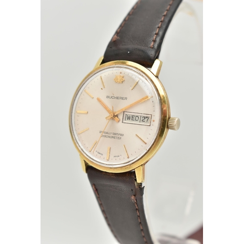 17 - A GENTLEMAN'S BUCHERER WRISTWATCH, the circular face with gold coloured baton markers and hands, day... 