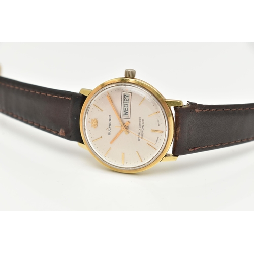 17 - A GENTLEMAN'S BUCHERER WRISTWATCH, the circular face with gold coloured baton markers and hands, day... 