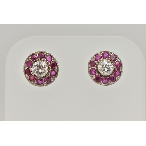 2 - A PAIR OF DIAMOND AND RUBY EARRINGS, designed as a round brilliant cut diamond, set with a surround ... 