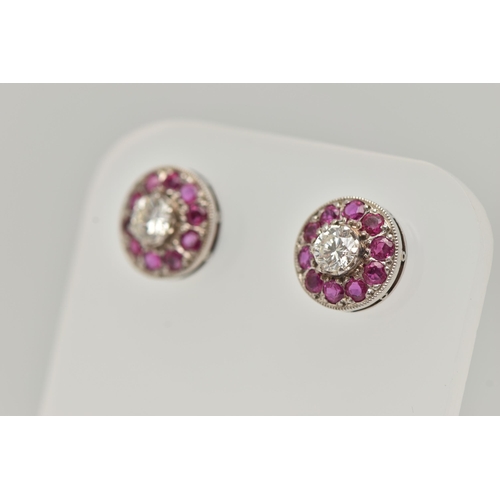 2 - A PAIR OF DIAMOND AND RUBY EARRINGS, designed as a round brilliant cut diamond, set with a surround ... 