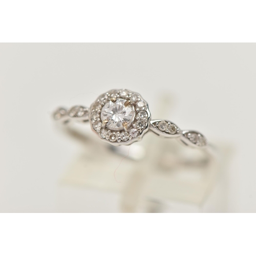 27 - A 9CT WHITE GOLD DIAMOND RING, centering on a round brilliant cut diamond, estimated diamond weight ... 