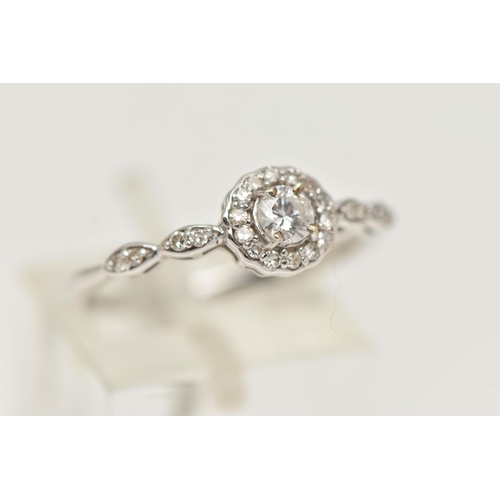 27 - A 9CT WHITE GOLD DIAMOND RING, centering on a round brilliant cut diamond, estimated diamond weight ... 