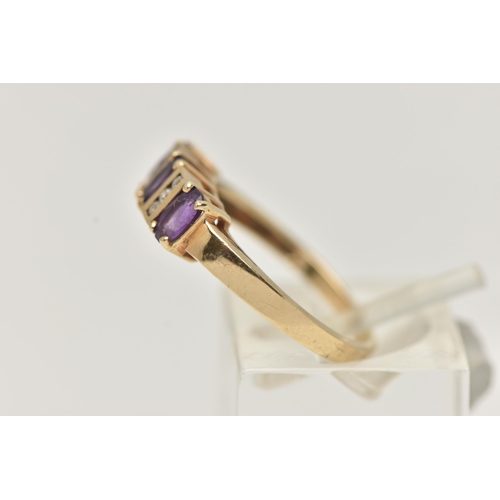 30 - A 9CT GOLD AMETHYST AND DIAMOND HALF ETERNITY RING, set with three oval cut amethysts, each claw set... 