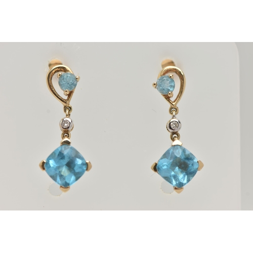 32 - A PAIR OF YELLOW METAL TOPAZ AND DIAMOND DROP EARRINGS, each pendant set with a square cut topaz, si... 