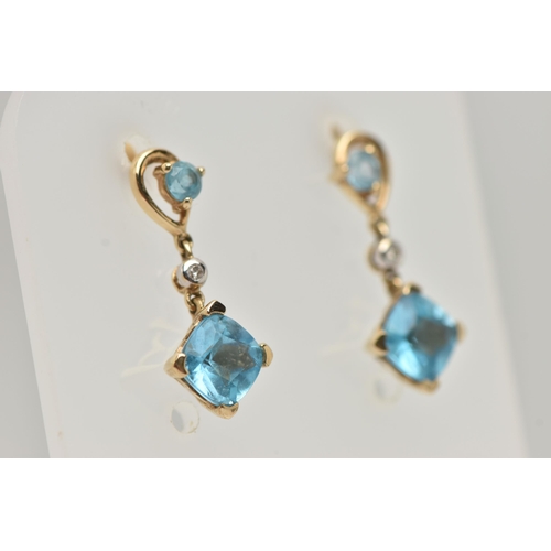 32 - A PAIR OF YELLOW METAL TOPAZ AND DIAMOND DROP EARRINGS, each pendant set with a square cut topaz, si... 