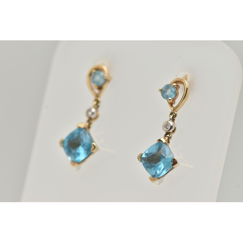 32 - A PAIR OF YELLOW METAL TOPAZ AND DIAMOND DROP EARRINGS, each pendant set with a square cut topaz, si... 