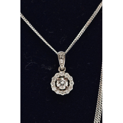 37 - A 9CT WHITE GOLD DIAMOND PENDANT AND WHITE METAL CHAIN, a circular cluster pendant, set with a centr... 