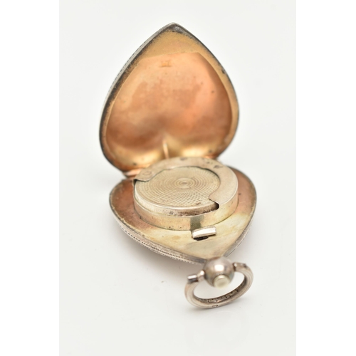 41 - AN EARLY 20TH CENTURY, SILVER HEART SHAPE SOVEREIGN CASE, foliate pattern with engraved cartouche, p... 