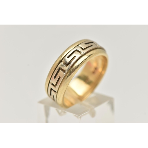 47 - A BI COLOUR GREEK RING, a yellow metal ring, fitted with a central spinning Greek key pattern, appro... 