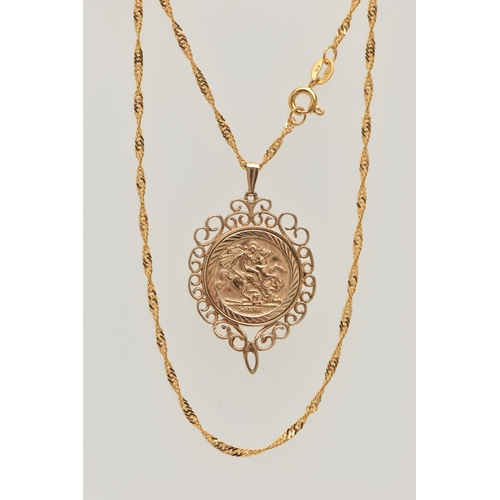 52 - A 9CT GOLD COIN PENDANT, a George and the Dragon disk, with a scrolling open work mount, hallmarked ... 