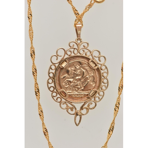 52 - A 9CT GOLD COIN PENDANT, a George and the Dragon disk, with a scrolling open work mount, hallmarked ... 