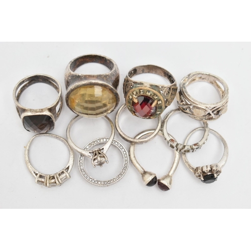 79 - A BAG OF WHITE METAL RINGS, to include eleven rings in total, some set with stones, seven stamped 92... 