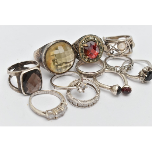 79 - A BAG OF WHITE METAL RINGS, to include eleven rings in total, some set with stones, seven stamped 92... 