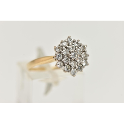 9 - A YELLOW METAL DIAMOND CLUSTER RING, cluster set with round brilliant cut diamonds, estimated total ... 