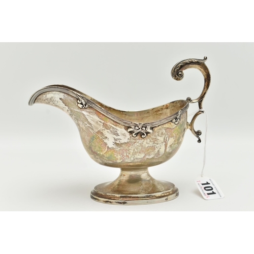 101 - A GEORGE V SILVER GRAVY BOAT, polished form, textured rim with floral detail, on an oval base with s... 