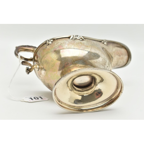 101 - A GEORGE V SILVER GRAVY BOAT, polished form, textured rim with floral detail, on an oval base with s... 