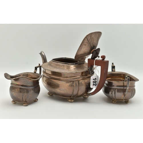 102 - A MID 20TH CENTURY SILVER TEA SET, three piece set comprising of a teapot, double handled sugar bowl... 