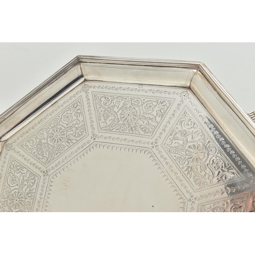 106 - A VICTORIAN SILVER SALVER, octagonal form salver etched with floral detail in eight panels following... 