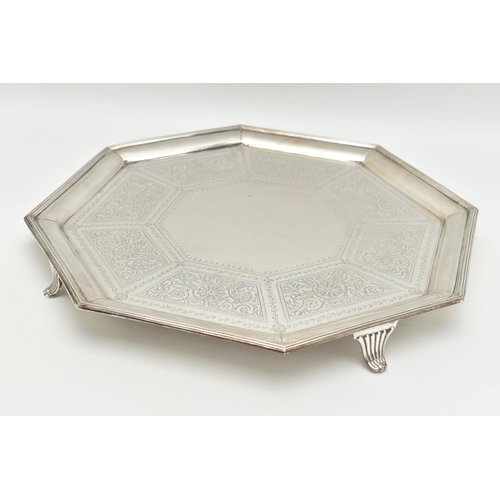 106 - A VICTORIAN SILVER SALVER, octagonal form salver etched with floral detail in eight panels following... 