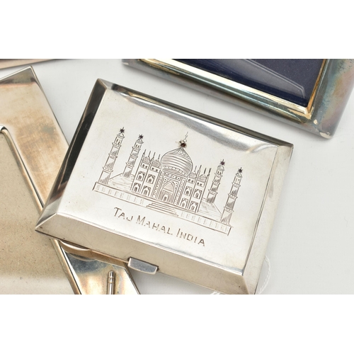 113 - A WHITE METAL CIGARETTE CASE AND PHOTO FRAMES, the cigarette case engraved depicting the Taj Mahal I... 