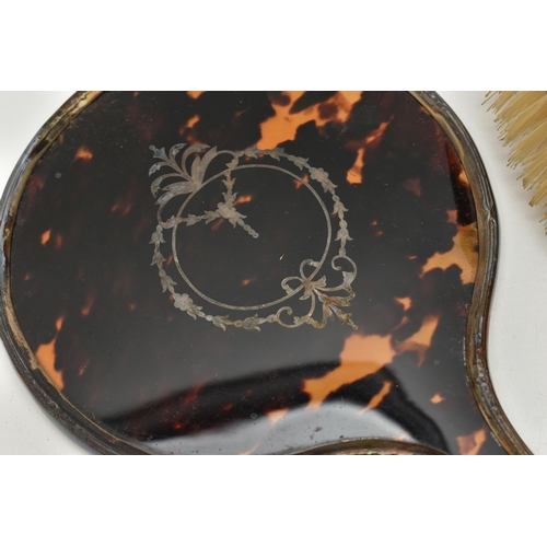 116 - A BOXED SILVER AND FAUX TORTOISESHELL DRESSING TABLE SET, comprising of two hair brushes, two clothe... 