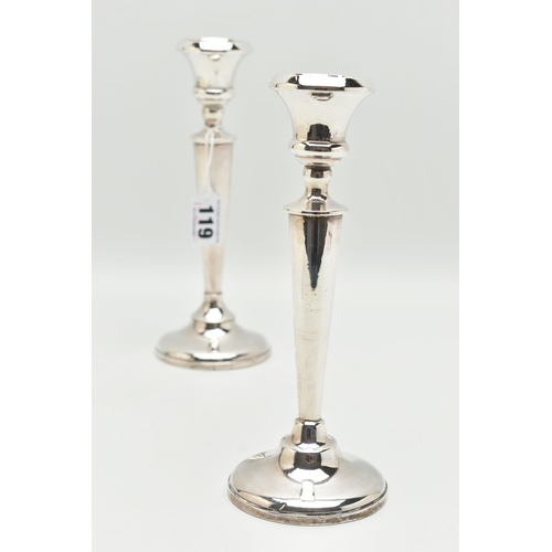 119 - A PAIR OF EARLY 20TH CENTURY CANDLESTICKS, tapering stems, on round weighted bases, hallmarked 'A J ... 