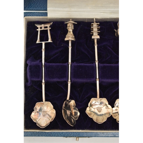 124 - A CASED SET OF CONTINETAL WHITE METAL TEASPOONS, a set of twelve teaspoons, with flower shape bowls,... 