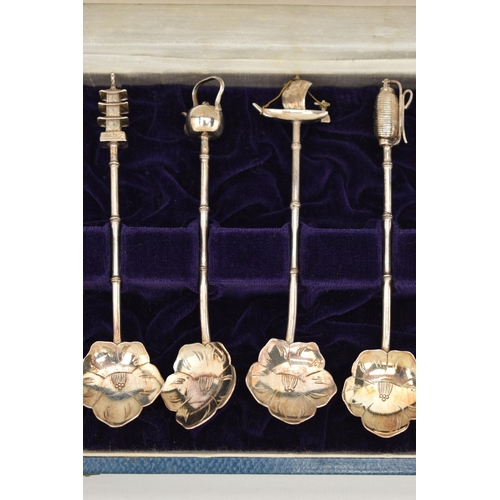 124 - A CASED SET OF CONTINETAL WHITE METAL TEASPOONS, a set of twelve teaspoons, with flower shape bowls,... 