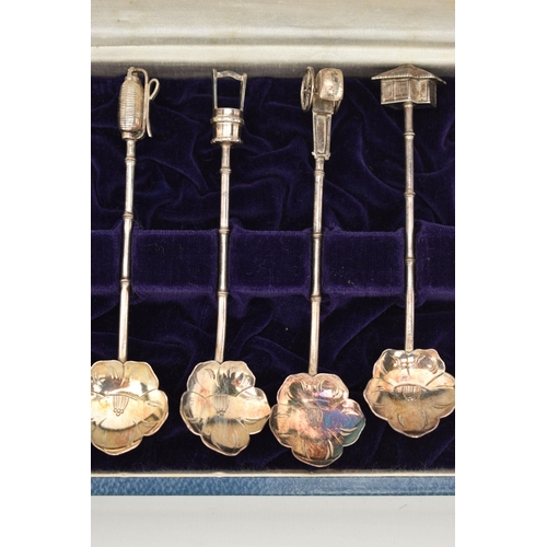 124 - A CASED SET OF CONTINETAL WHITE METAL TEASPOONS, a set of twelve teaspoons, with flower shape bowls,... 