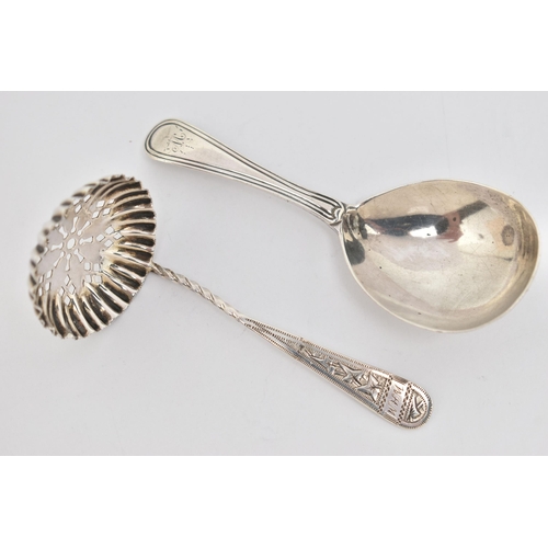 88 - TWO SILVER SPOONS, the first a George III silver caddy spoon with engraved M initial to the terminal... 