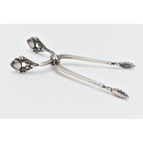 89 - A PAIR OF GEORG JENSEN SILVER SUGAR TONGS, with stylised acorn handles, maker's marks, import mark f... 