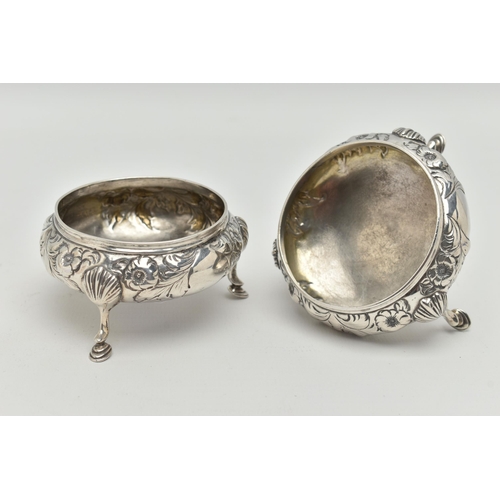 92 - A PAIR OF EARLY VICTORIAN SILVER SALTS, of circular outline with embossed floral and foliate decorat... 