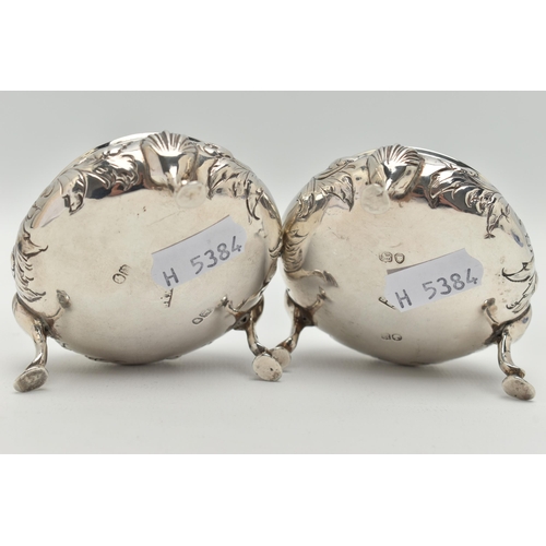 92 - A PAIR OF EARLY VICTORIAN SILVER SALTS, of circular outline with embossed floral and foliate decorat... 