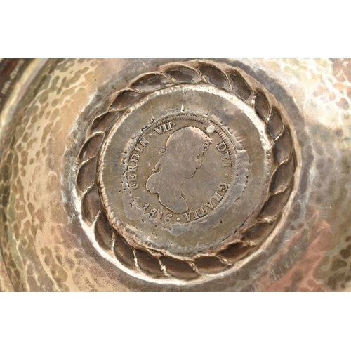 97 - A PERUVIAN WHITE METAL DISH MOUNTED WITH A SPANISH COIN, round dish, stamped to the reverse 'Kohler ... 