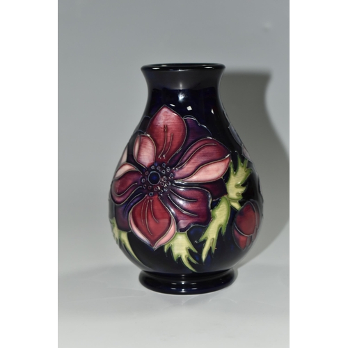 329 - A MOORCROFT POTTERY 'ANEMONE' PATTERN VASE,  of baluster form, purple and mauve flowers on a dark bl... 