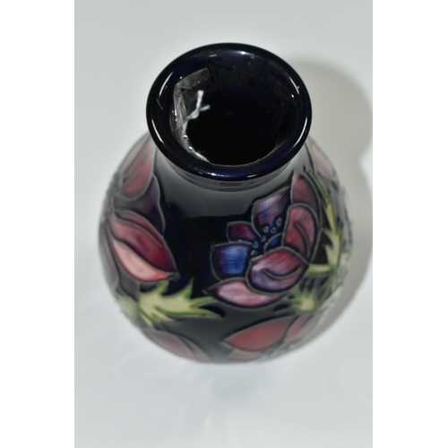 329 - A MOORCROFT POTTERY 'ANEMONE' PATTERN VASE,  of baluster form, purple and mauve flowers on a dark bl... 