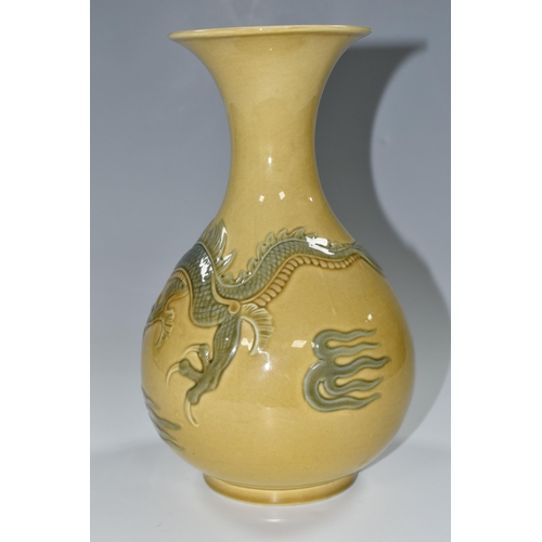 336 - A LLADRO RELIEF MOULDED DRAGON VASE, the mustard ground decorated with a four clawed dragon, printed... 