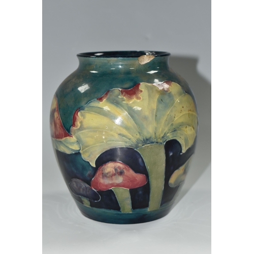 345 - A MOORCROFT POTTERY 'CLAREMONT' DESIGN VASE, a red, green and purple mushroom design on a blue/green... 