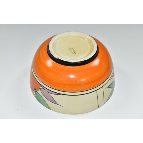 379 - A NEWPORT POTTERY BOWL HANDPAINTED WITH A DESIGN OF ORANGES, orange band to inner rim, black printed... 