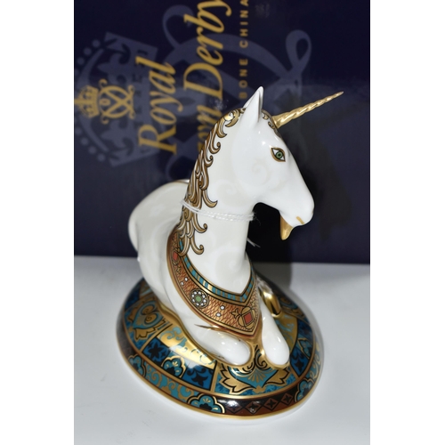 381 - A BOXED ROYAL CROWN DERBY LIMITED EDITION 'UNICORN' PAPERWEIGHT, designed to celebrate the New Mille... 